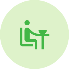 デスクに人が座っている様子のイメージアイコン